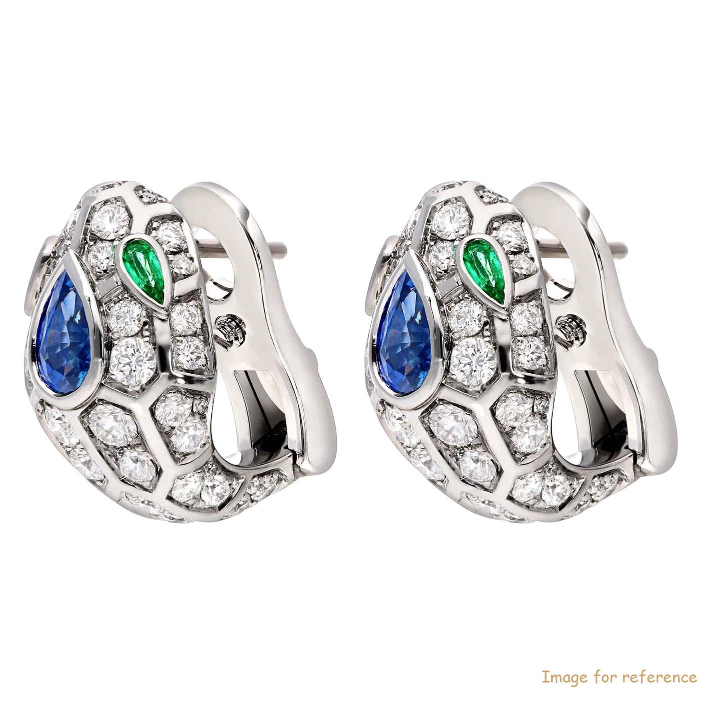 Thiết kế tùy chỉnh 18 kt white gold earrings, set with a blue sapphire on the head, emerald eyes and pavé diamonds OEM Jewelry manufacturers